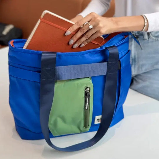 Blue-green Breeze Laptop Tote Bag by Monkey Troopers with sturdy handles and spacious interior, ideal for carrying laptops and accessories.