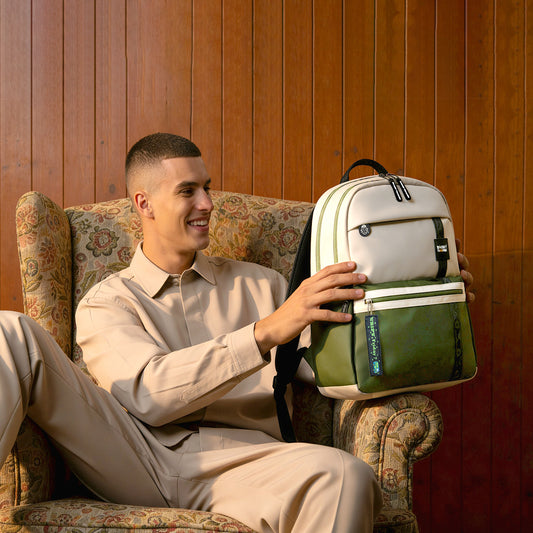 Beige-olive Trippy backpack by Monkey Troopers featuring a colorful, psychedelic design with adjustable straps and multiple compartments.